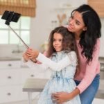 daughter-taking-selfie-with-mom_23-2148389455